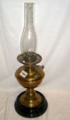 A Victorian brass oil lamp on pot base