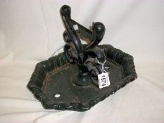 A cast iron boot scraper