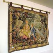A tapestry on brass rail