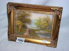 A small gilt framed oil on board, signed Bradford