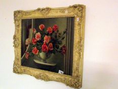 A floral oil on board, signed Victor Hernandez