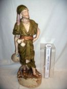 A Royal Dux figure being a water carrier