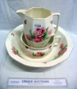 A jug, basin and chamber pot decorated with roses