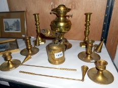 A mixed lot of brassware including candlesticks, blow lamp etc.