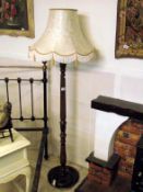 A standard lamp with shade