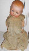 A Bisque headed porcelain doll with composition body a/f