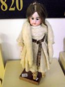 An early porcelain headed doll (French or German)