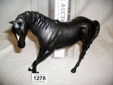A Beswick black stallion