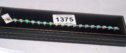 A 9ct gold and opal bracelet