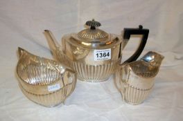 A Hall marked 3 piece silver tea set (750 grammes)