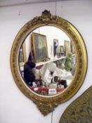 A gilt framed decorative mirror