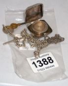 A silver sovereign case a/f and an Albert watch chain