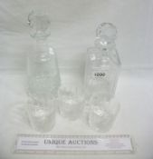2 glass decanters and 3 tumblers with golf related etchings