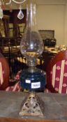 An oil lamp with blue glass font