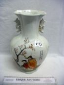 A hand decorated Chinese vase