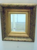 An ornate framed bevel edged mirrror