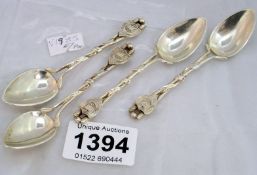 4 silver spoons with shields on handles