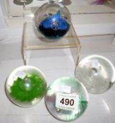 4 Caithness paperweights including 'Triple Crown' and 'Sentinal'