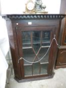 A Victorian astragal glazed corner cabinet