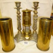 A brass Miner's lamp, Pair of brass gunshells and pair of brass candlesticks