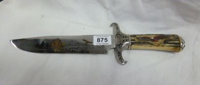 A Bowie knife decorated with eagles