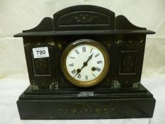 A black mantel clock, in working order