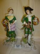 A pair of porcelain figurines with gilded anchor mark