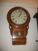 A mahogany drop dial wall clock