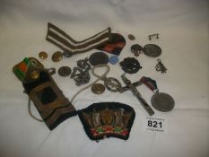 A mixed lot of badges, buttons etc