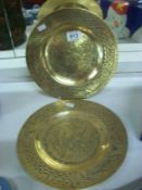 A pair of Chinese brass plates with Serpents on base, signed