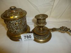 A Victorian brass string box and a Victorian chamber candlestick