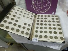 A Collectable album of 11 pages of coins including silver