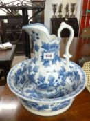 A blue and white jug and bowl set