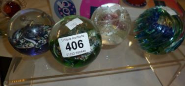 4 Caithness paperweights including 'Myriad' and 'Optix'.