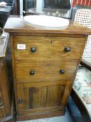 A mahogany washstand with marble inset