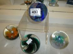 4 Caithness paperweights including 'Fascination' and 'Steel Blue'