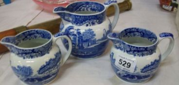 A set of 3 Spode Blue and White jugs