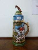 A large lidded beer stein surmounted figure of a fox (ear chipped)