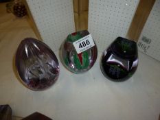 3 boxed Caithness paperweights being 'Deliverer', 'Lavender Bouquet' and 'Spice Hibiscus'