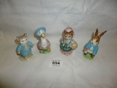 4 Beswick Beatrix Potter figures being Jemima Puddleduck, Cousin Ribby, Peter Rabbit and Tom Kitten