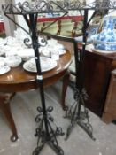 A pair of wrought iron plant stands