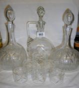 2 glass decanters, a glass claret jug and 6 glass napkin rings