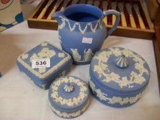 4 items of Wedgwood jasper ware (3 lidded pots and a jug)