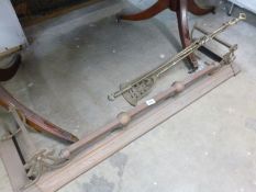 A Victorian brass fender and fire irons