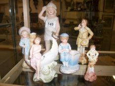 A collection of old bisque figures