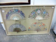 4 hand painted fans in glass case