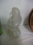 A glass lidded jar in the shape of an eagle