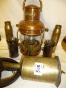 A Copper lantern, 3 brass shell cases, a brass spit etc.,