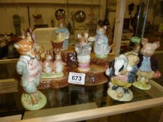 9 Beswick Beatrix potter figures a/f and a display stand (stand good)