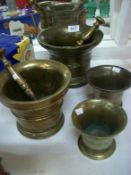 2 large brass pestle and mortars and 2 smaller mortars